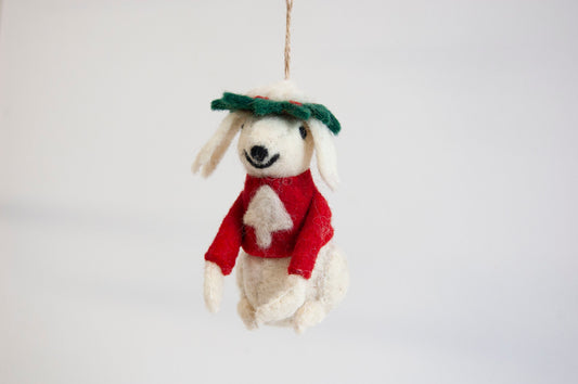 Decorative poodle ornament with a red scarf and green leaf hat on a white background - ZWEIBIE