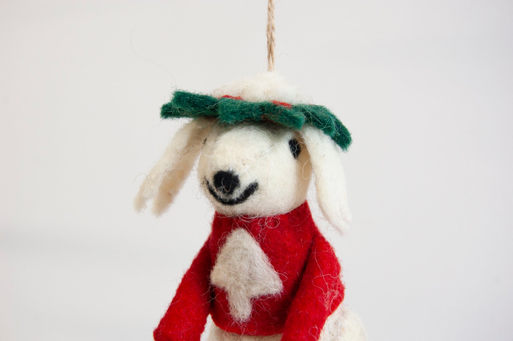 Decorative poodle ornament wearing a red sweater and green hat on a white background - ZWEIBIE